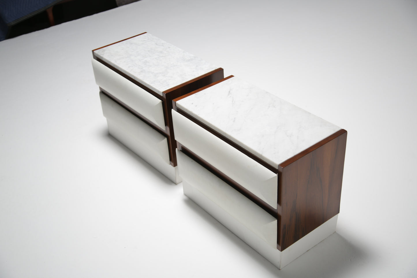 Walnut and marble bedside tables