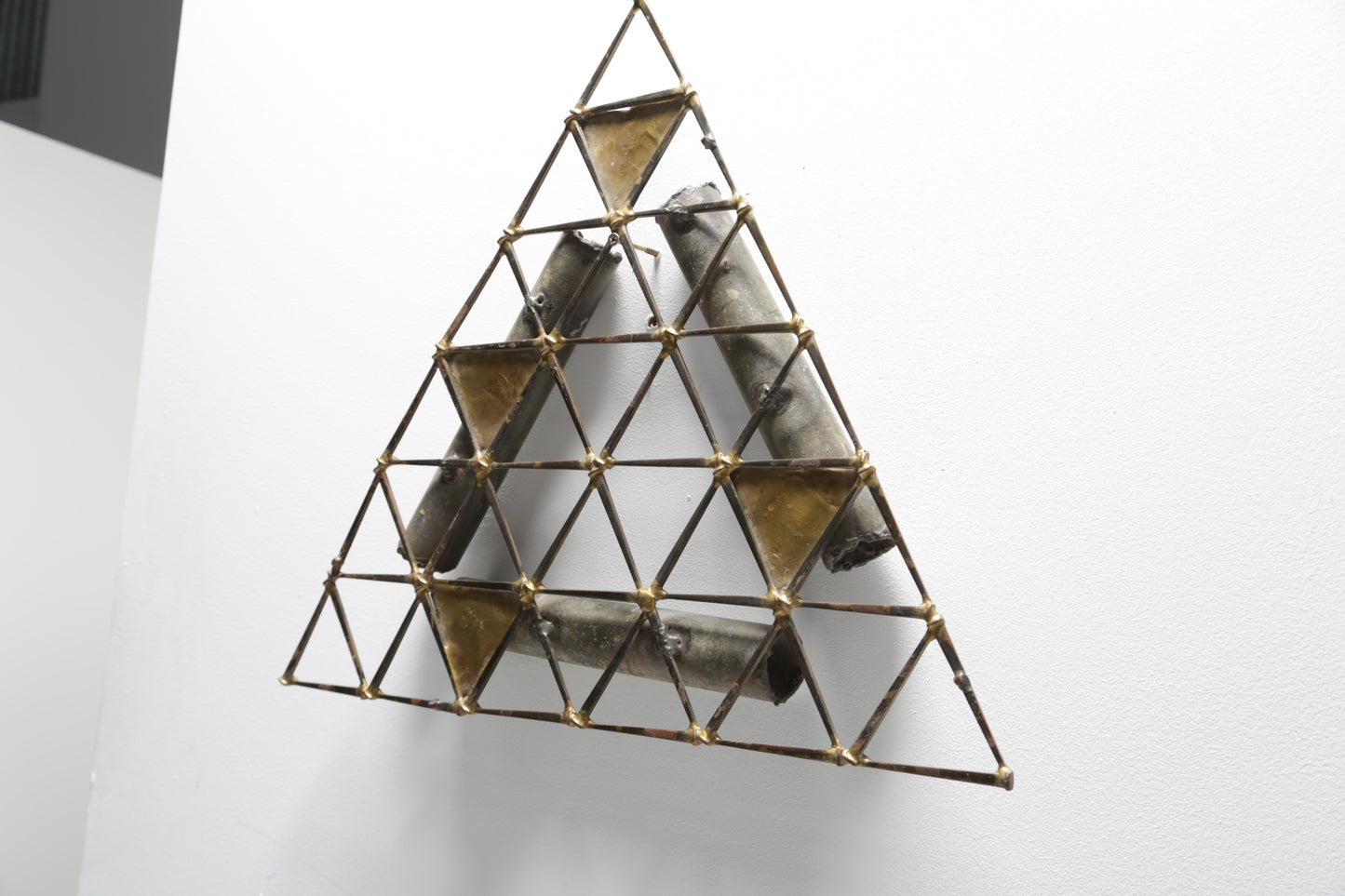 Brutalist triangular wall sculpture in the style of Ron Schmidt