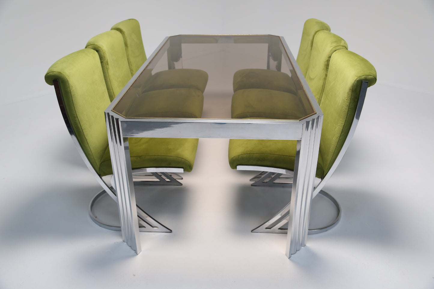 Aluminium dining table with glass top.