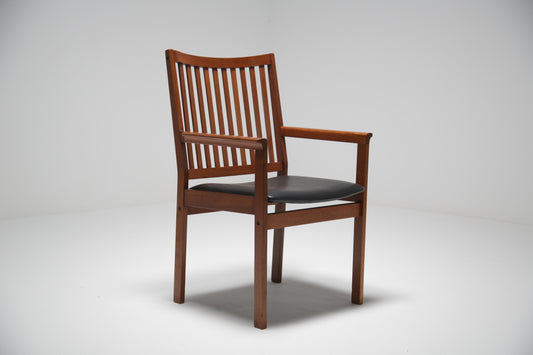 A simple teak Windsor style armchair